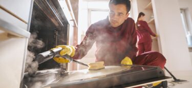 Professional janitorial personnel doing eco-friendly kitchen cleaning