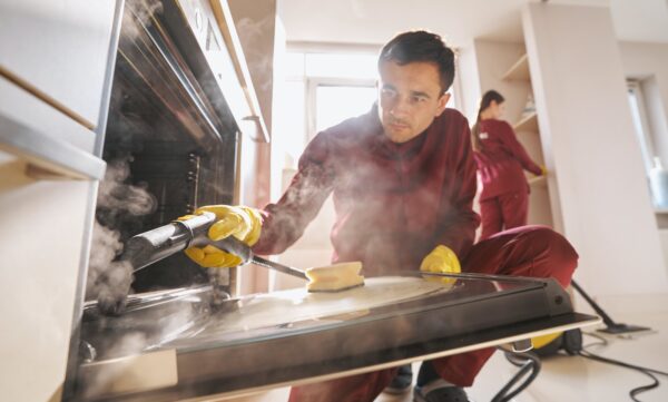 Professional janitorial personnel doing eco-friendly kitchen cleaning